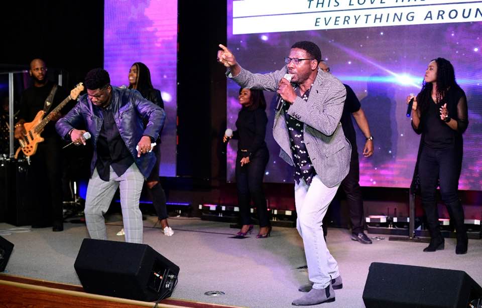 Prexy Sam Ola leading worship